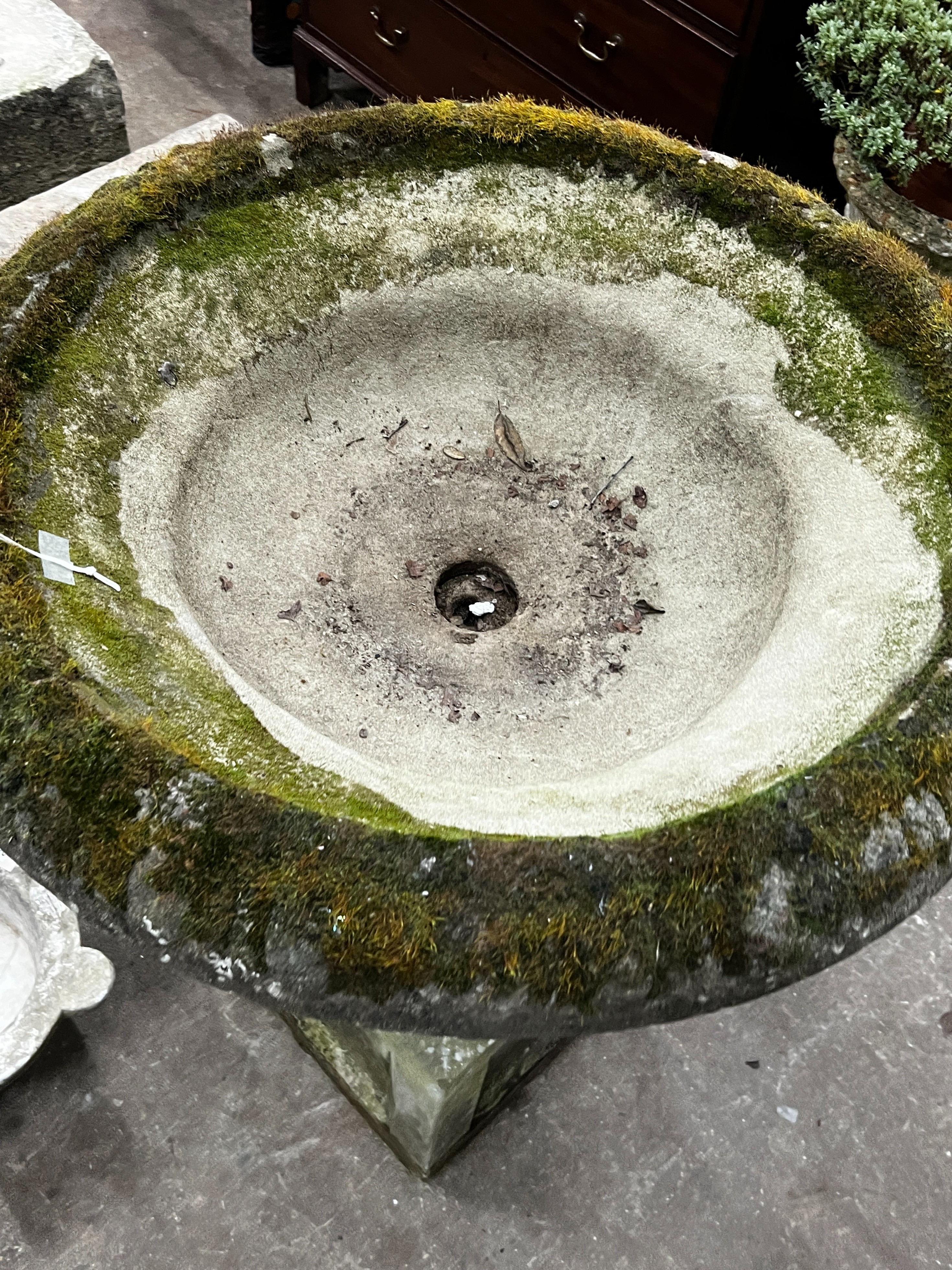 A reconstituted stone circular campana planter on square plinth, diameter 80cm, height 102cm